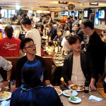 People enjoying a bonenkai at a sports bar in Nagoya