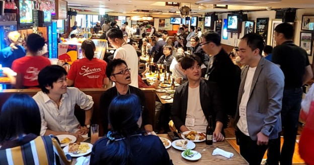 People enjoying a bonenkai at a sports bar in Nagoya